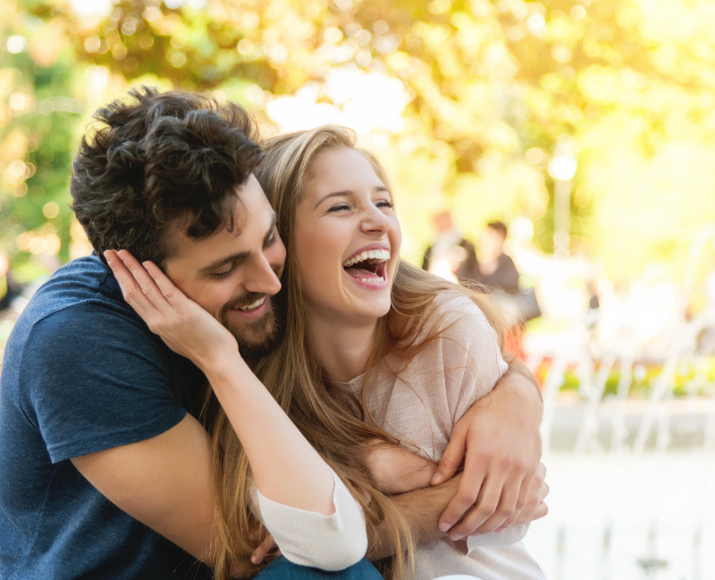 couple laughing in park