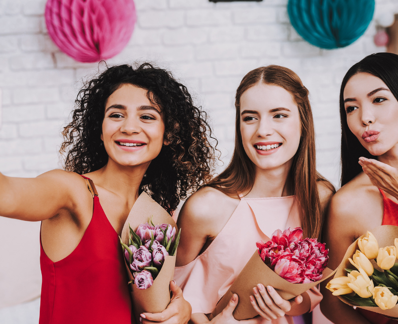 three girl taking picture