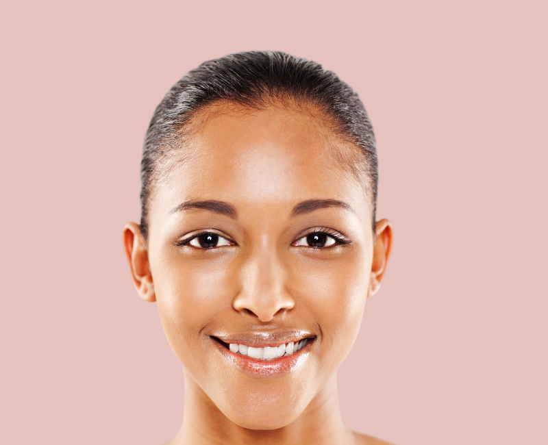 girl smiling pink background