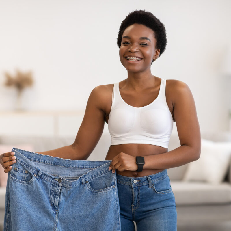 Woman showing weight loss